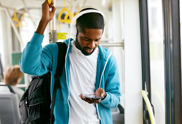 a man listing to SoundHound Music App