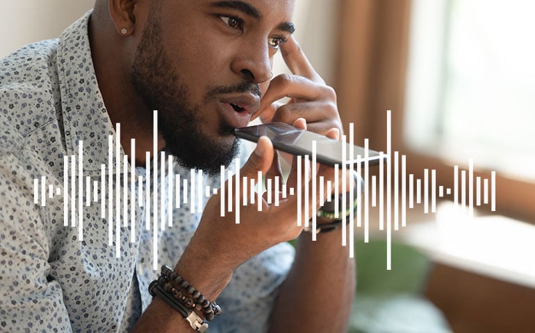 man talking to voice-enabled device