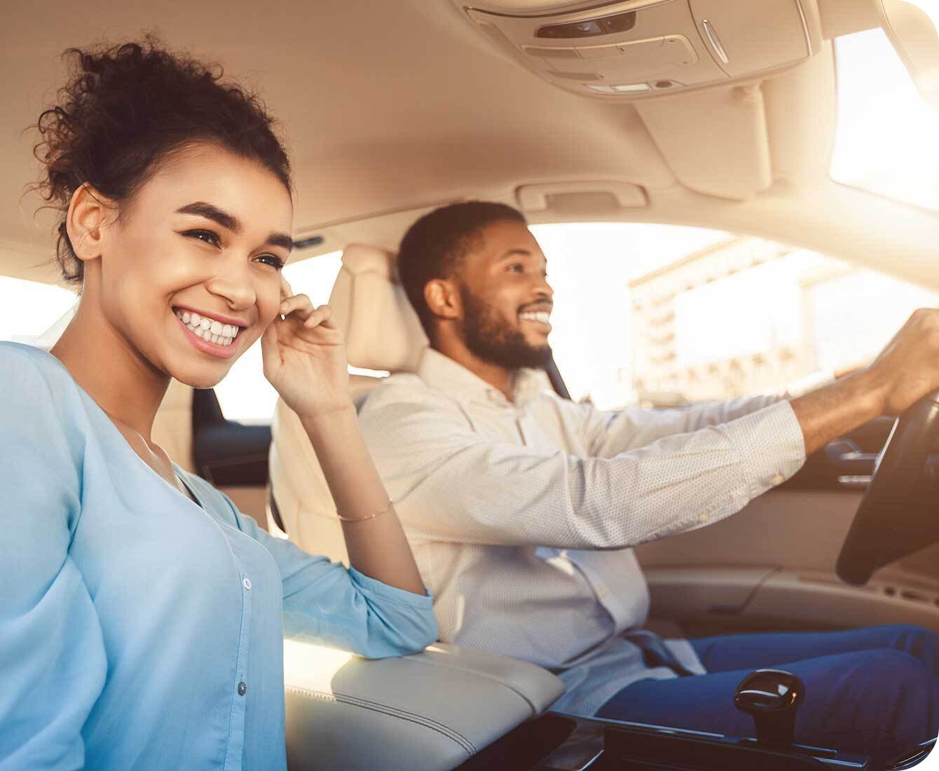 two people driving and using a voice assistant in-car